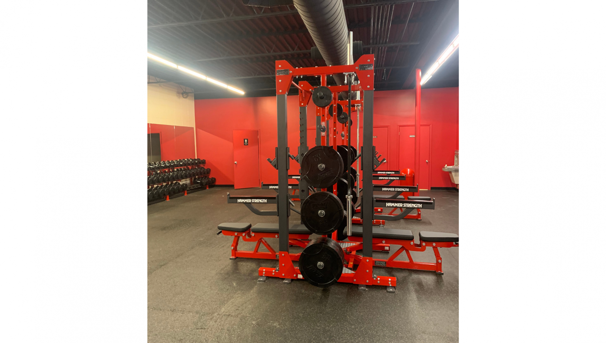 Hammer Strength Elite Combo Half Racks with Adjustable Benches and Olympic Bar.
