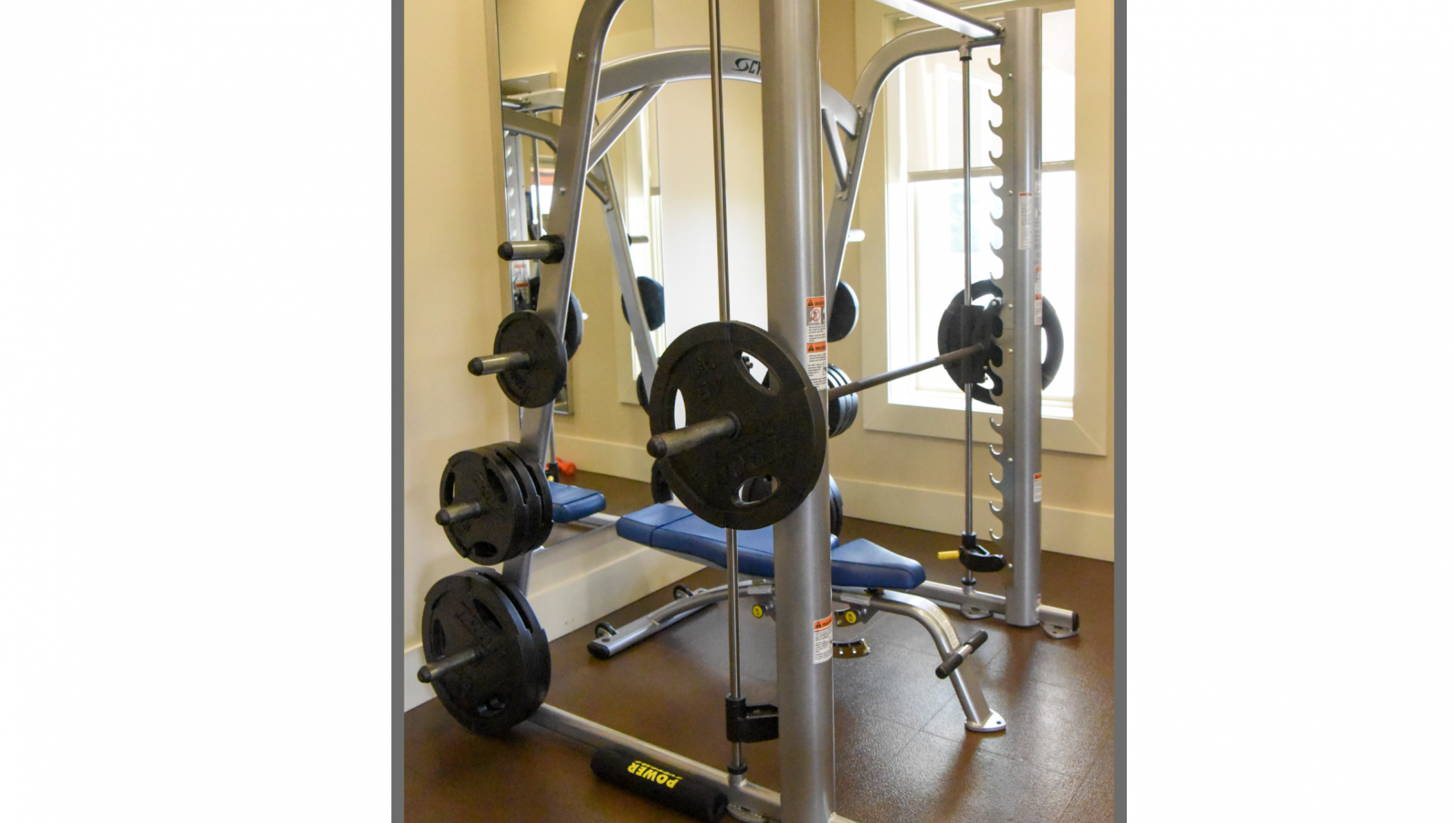Cybex Smith Press in Corporate Setting with Adjustable Bench.